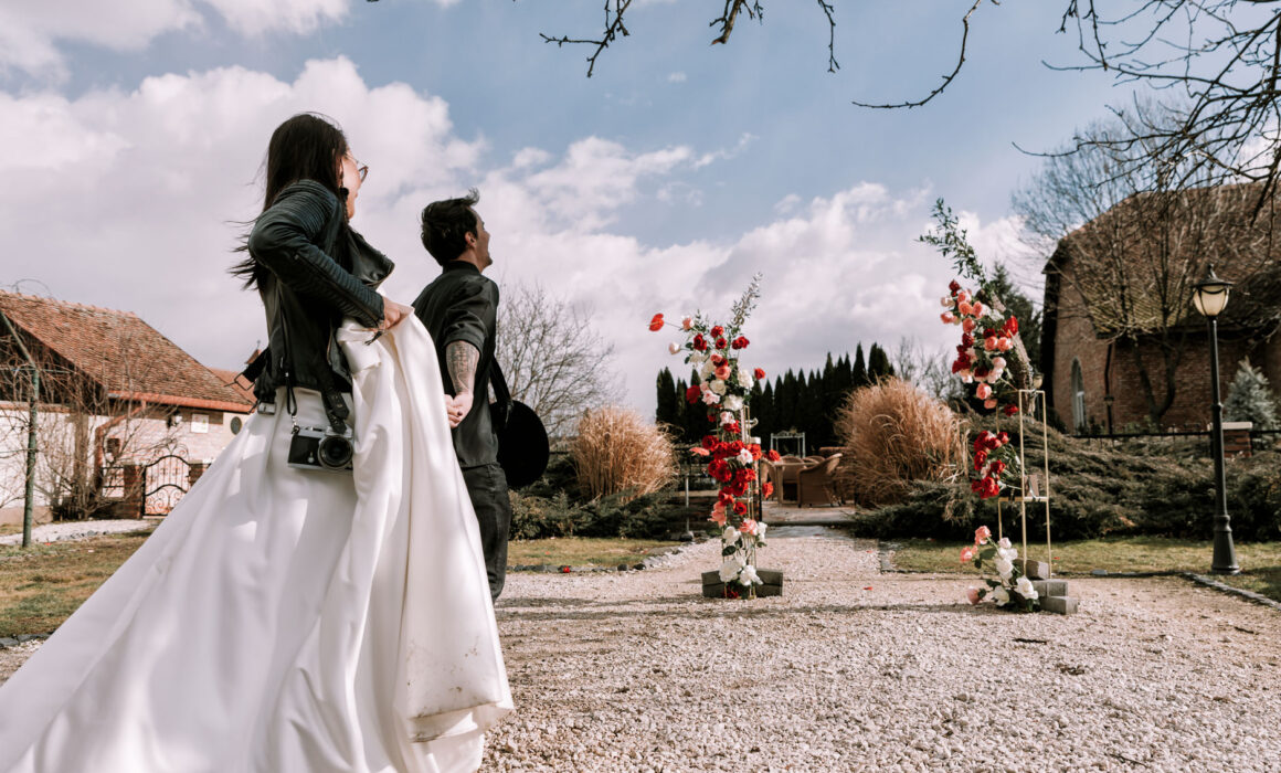 The bride is led by the groom to the ceremony, during the elopement.